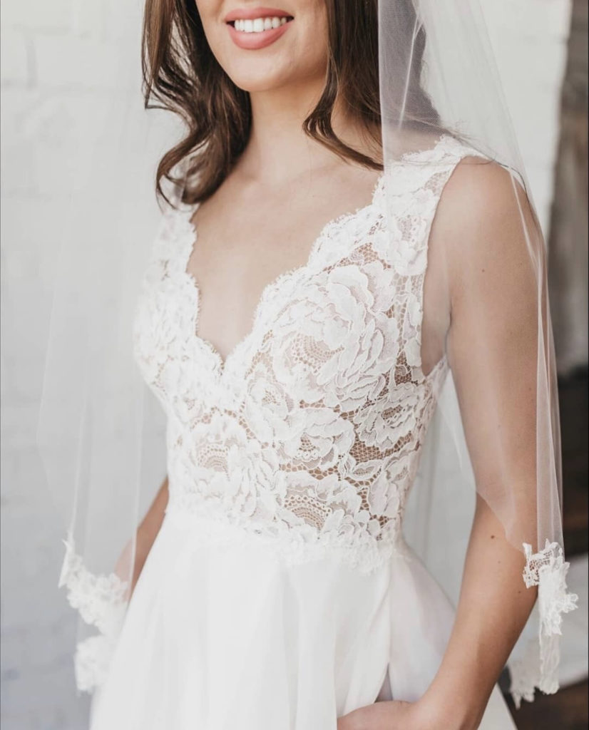 Lace wedding dress by Paloma Blanca