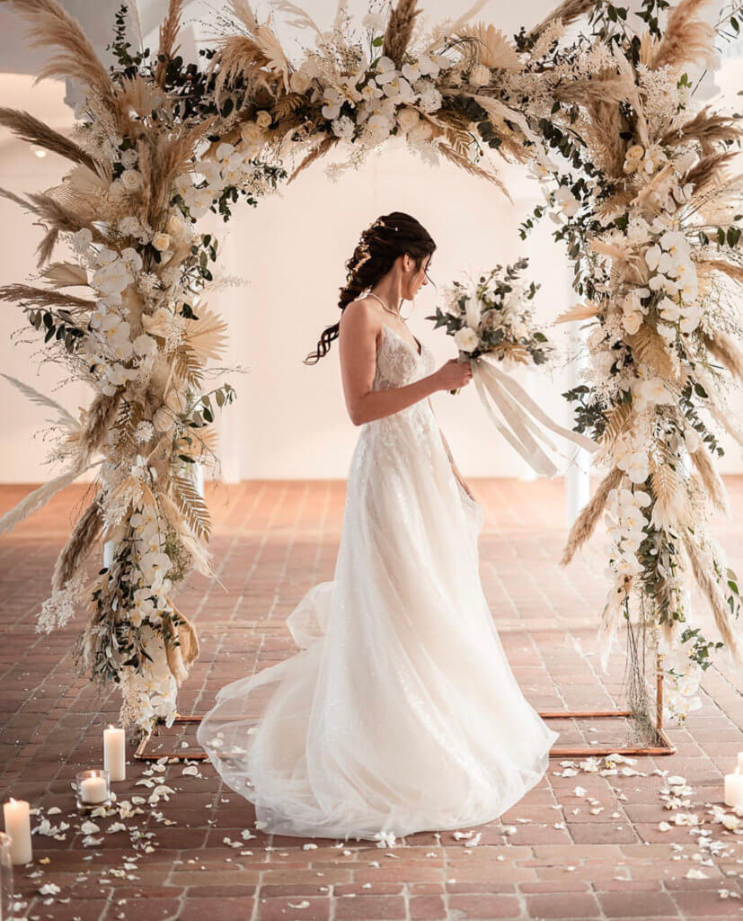 bride and the wedding arch